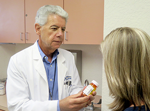 A doctor consulting patient on medication