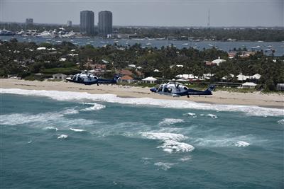 Two helicopters flying over Palm Beach County