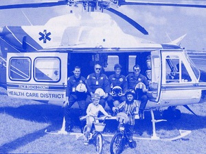 Trauma Hawk flight crew sitting in the helicopter for a group photo