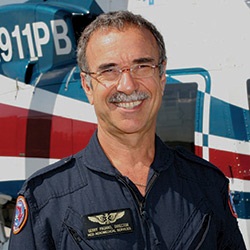 A photo of Gerald M Pagano standing in front of the Trauma Hawk