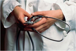 A doctors hands holding a stethoscope