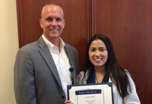 Employee of the month Estefania Idarraga with Rick Roche