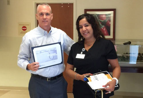 Annette Rivera employee of the month with Hospital Administrator Rick Roche