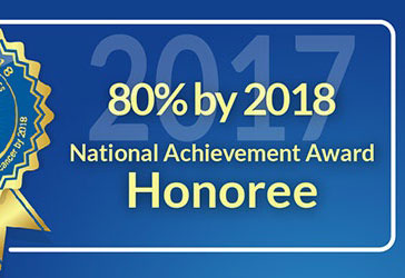 Ribbon with text to the right that reads 80 percent by 2018. National Achievement Award Honoree