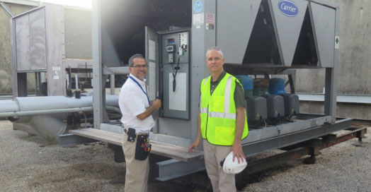 Al and Rick on the top of the Health Care District building working on the air conditioner.