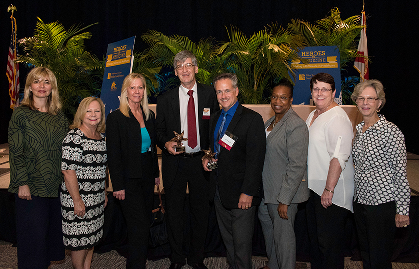 The Health Care District group at the Heroes in Medicine awards stand together for a photo.