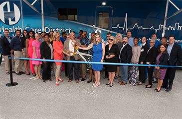 Image of Health Care District Staff and Partners Cutting the Ribbon