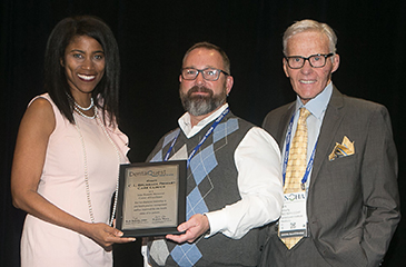 Clinic staff receiving dental award