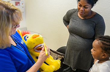 Dental staff with baby