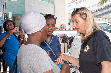 Dr. Belma Andric talking to an evacuee