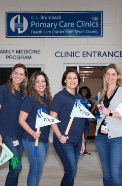 4 women on the tour of the new Belle Glade clinic