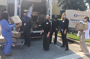 Donated supplies being dropped off at the Healey Center