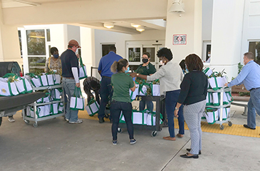 Florida Crystals and Hundley Farms donating food to LMC Staff