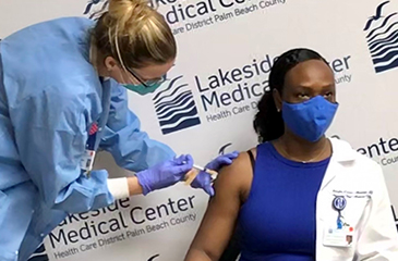Dr. Medard receives vaccine