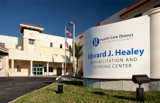 Exterior of the Healey Center. The signage is in the foreground. The building is in the background