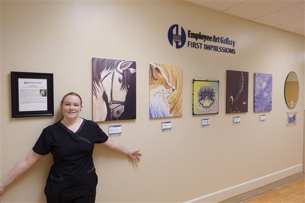 Ruth Cooper in front of her gallery