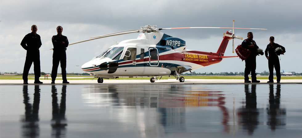 Trauma Hawk flight crew standing to the left and right of the helicopter